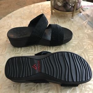 Size 7. Black with 3 sparkly straps. Velcro adjustable straps. Platform